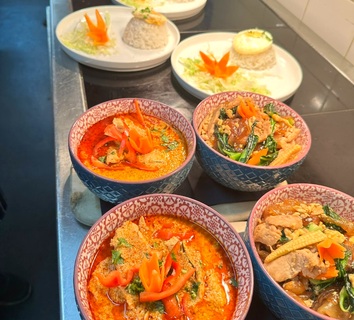 Thai curries prepared for service