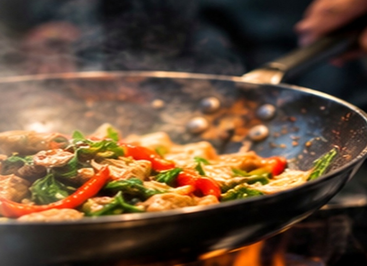 Thai food being cooked in a wok